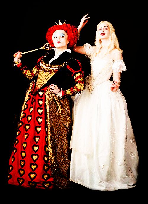 two women dressed in costume posing for a photo