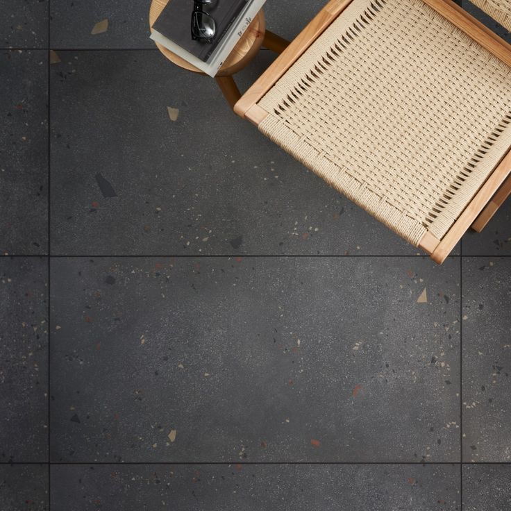 an overhead view of a table and chair with a radio on the side, next to it