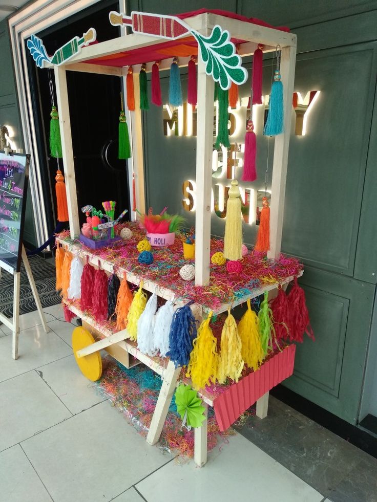 there is a colorful display with tassels on it