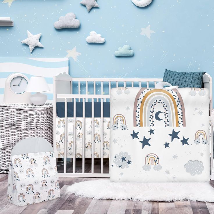 a baby's room with a crib, bedding and wallpapers