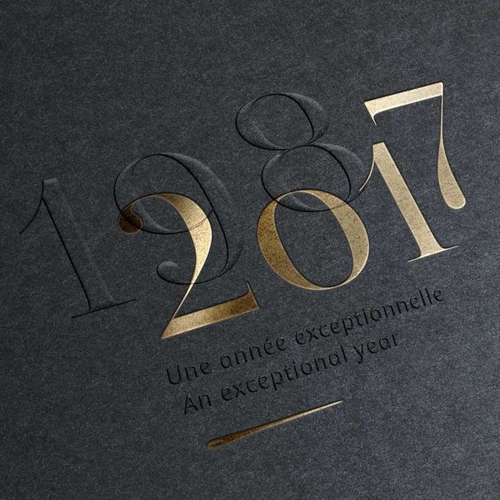 a black book with gold lettering and numbers on the cover is shown in this image