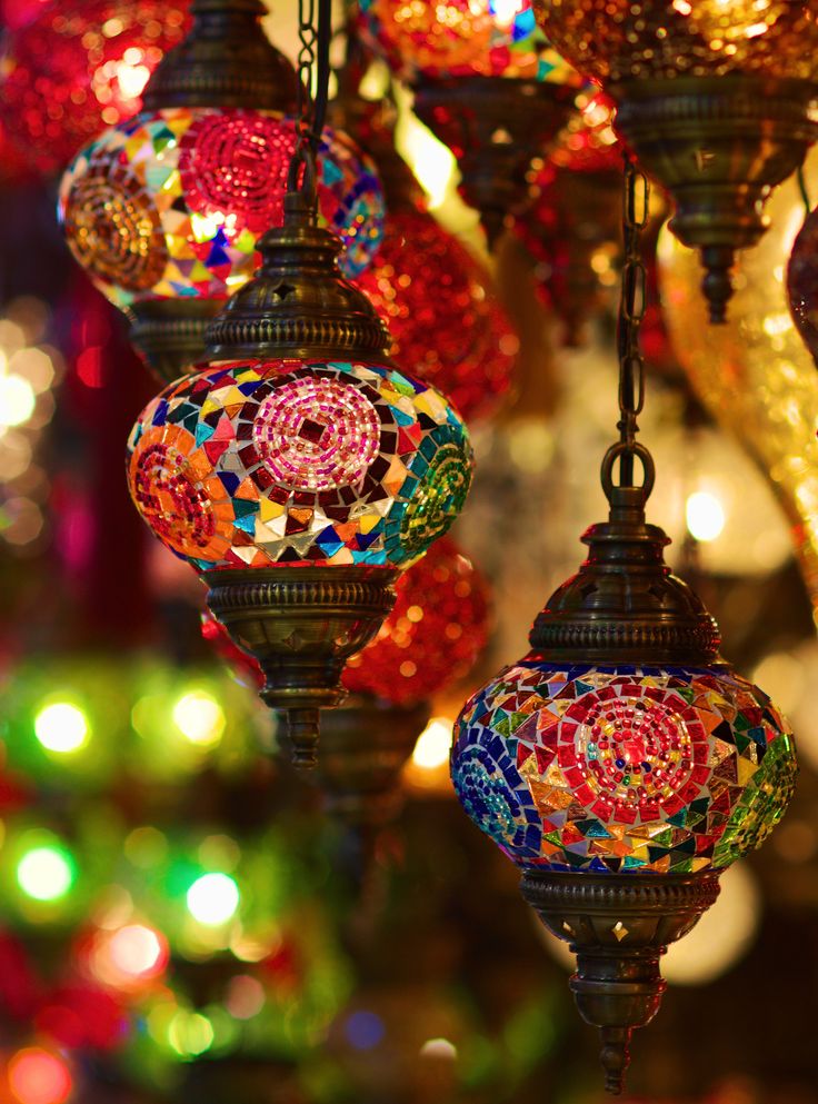 many colorful lights hanging from the ceiling