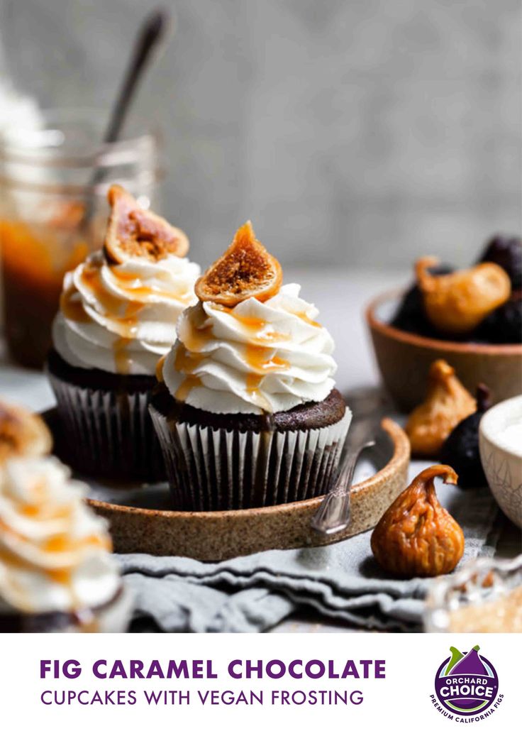 cupcakes with white frosting and walnuts on the side, surrounded by other dessert items