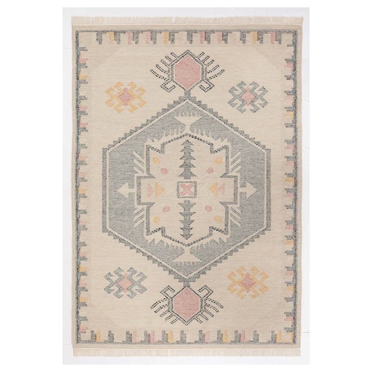 a rug with an intricate design on the front and back side, in light grey