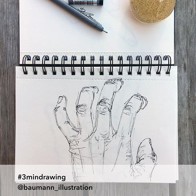 a notepad with a drawing of two people holding their hands up in the air