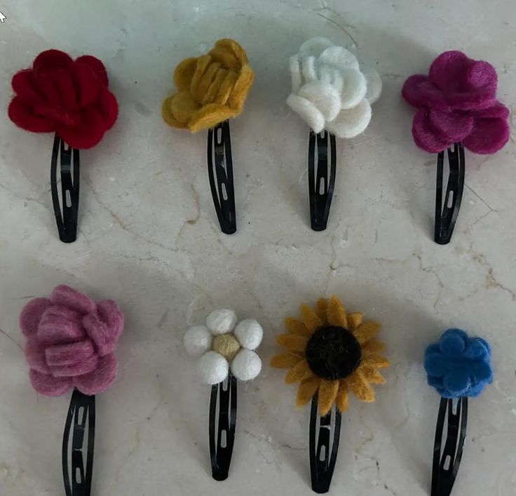 Handmade Felt "Flower" Hair Clip Available in 8 styles / colors Each hair clip is handmade and ethically produced providing fair wages and safe working conditions. Hair clips are made using 100% New Zealand wool. Clips are tagged and placed in organza gift bags. Diy Jewelry To Sell, Cape Elizabeth, Felt Hair Clips, Flower Hair Clip, Felt Flower, Handmade Felt, Flower Hair Clips, Organza Gift Bags, Flower Hair