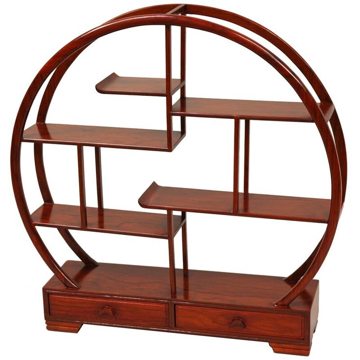 a wooden shelf with three shelves in the shape of a circle on top of it