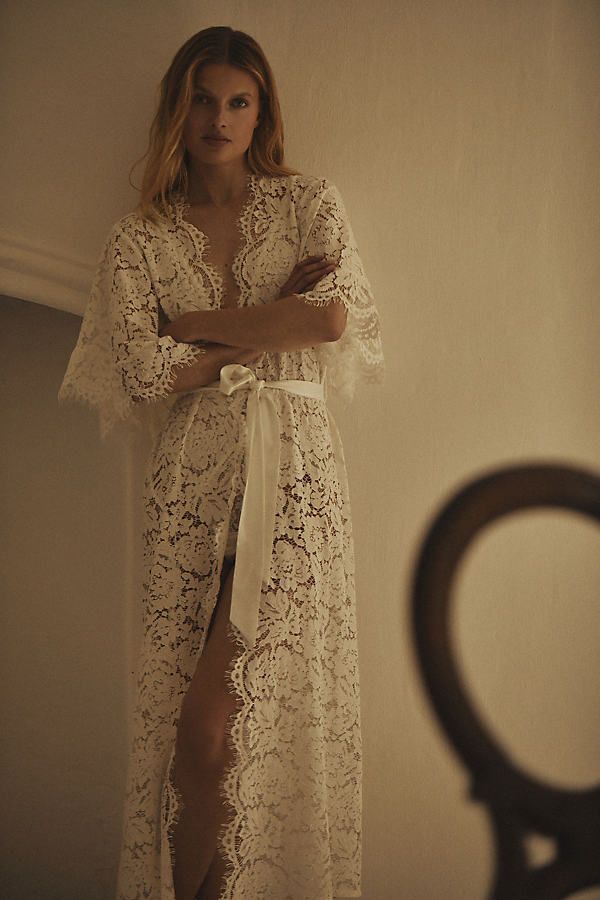 Lace-lined and tied with a silky sash, this romantic robe features delicate flowy sleeves and scalloped trim. | Saskia Long Lace Robe by Homebodii in White, Women's, Size: Medium, Polyester at Anthropologie Lace Sleeve Robe, Lace Robe Dress, Lace Bridal Robe, Contemporary Bridal, Anthropologie Wedding, Wedding Robe, Flowy Sleeves, Bhldn Weddings, Bridesmaid Robes