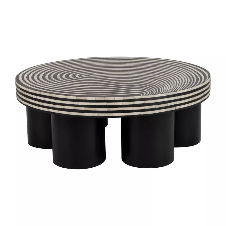 three black and white tables with circular designs