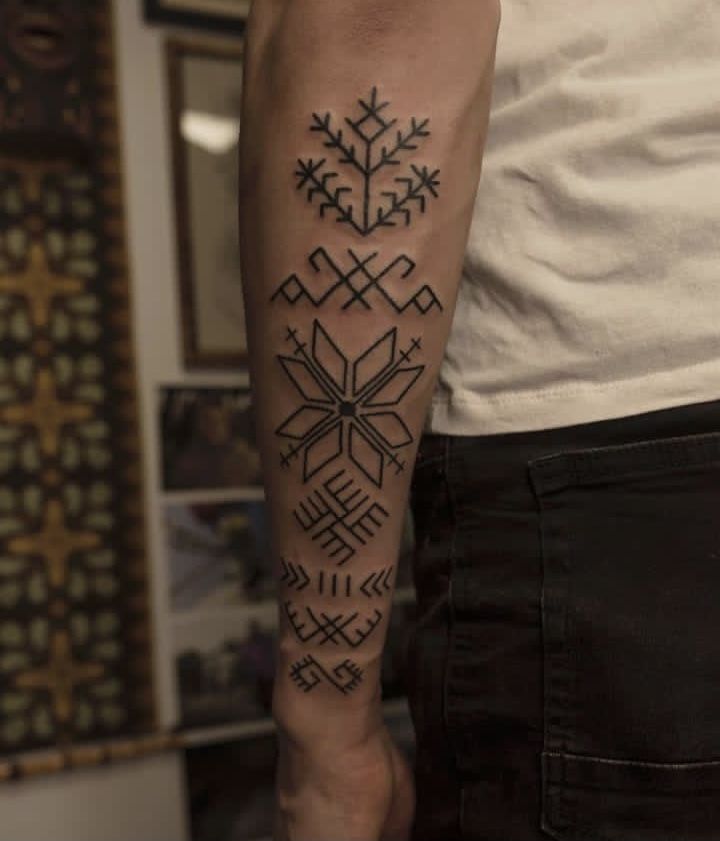 a man with a tattoo on his arm