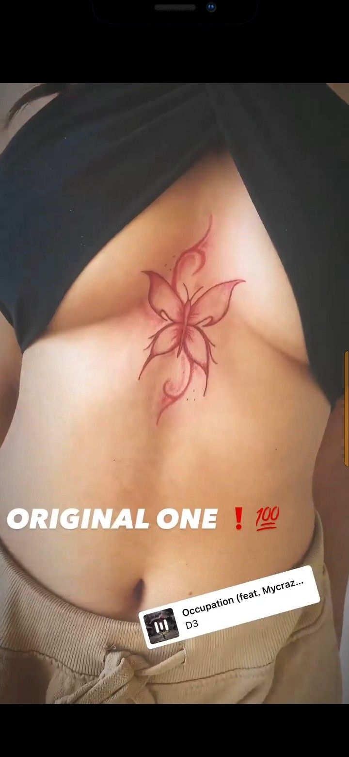 an image of a woman's stomach with a flower tattoo on the side and words that read original one