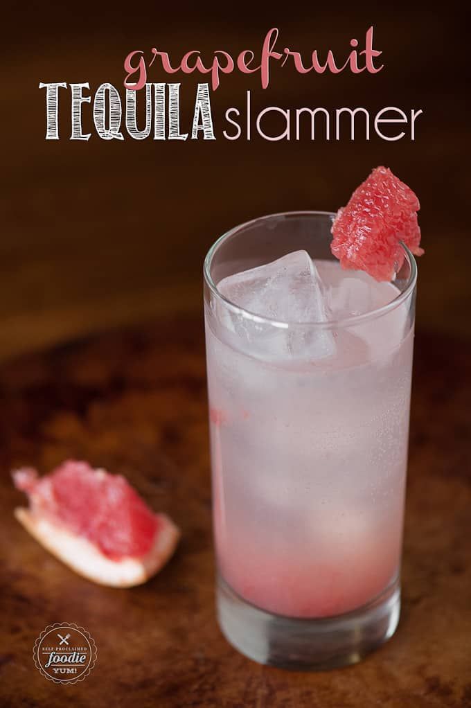 a grapefruit cocktail is garnished with ice