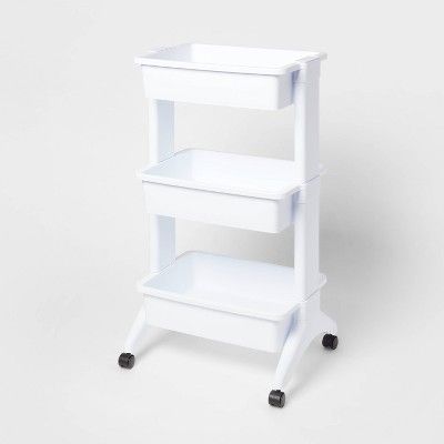 a white shelf sitting on top of a table