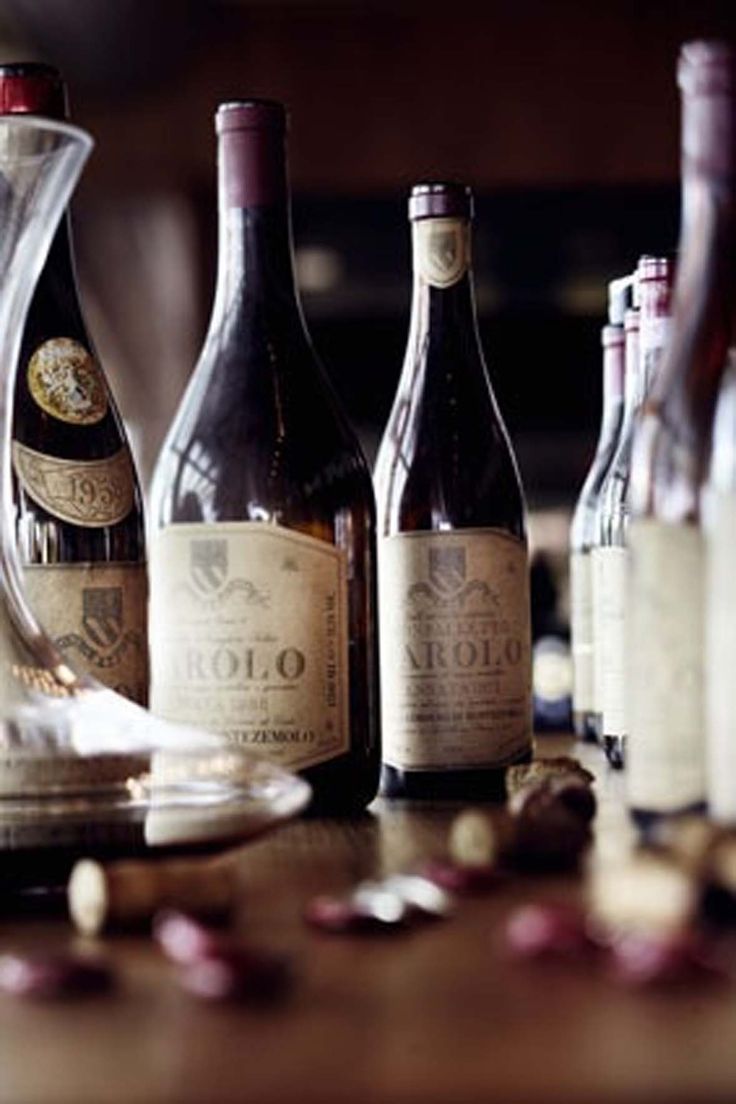 several bottles of wine sitting on top of a wooden table