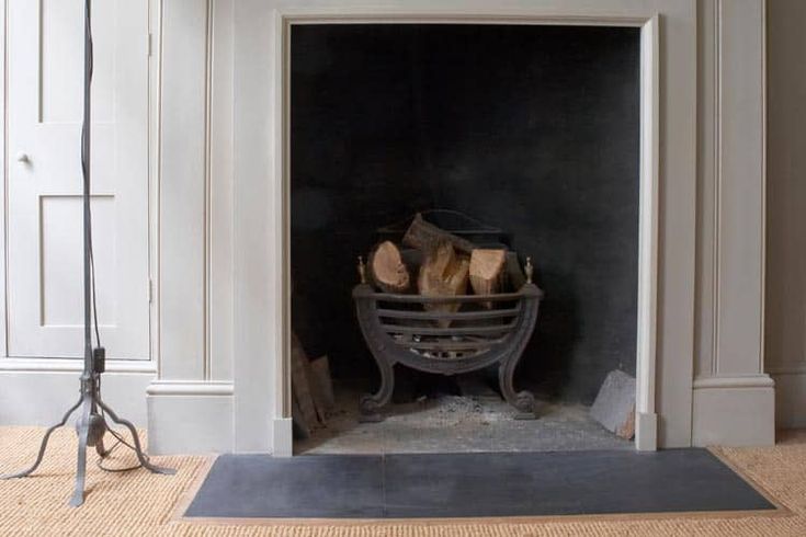 a fire place with logs in the fireplace