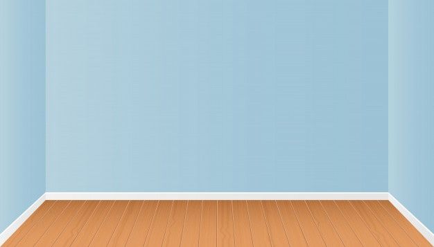 an empty room with blue walls and wooden floors