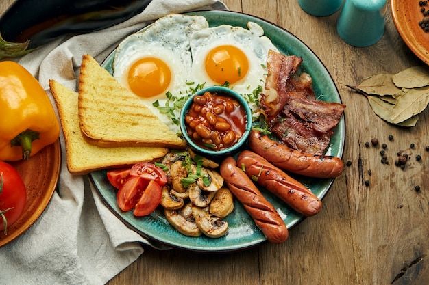 a plate with eggs, sausages and toast on it next to other food items