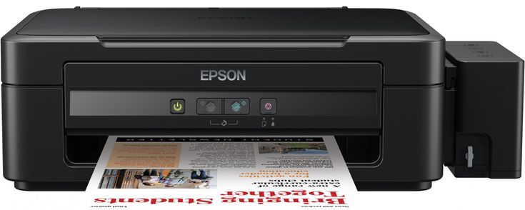 an epson printer sitting on top of a magazine next to it's print capabilities