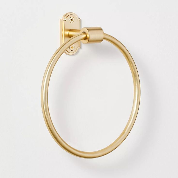 a gold towel ring on a white background