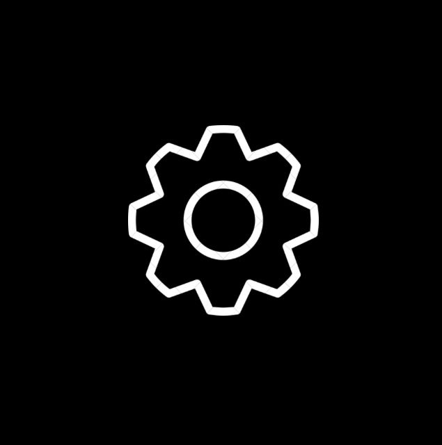 a black and white image of a cogwheel