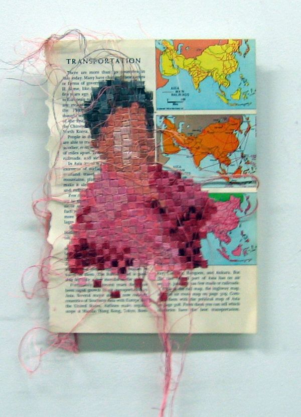 a piece of paper that has been sewn together with yarn and thread on it