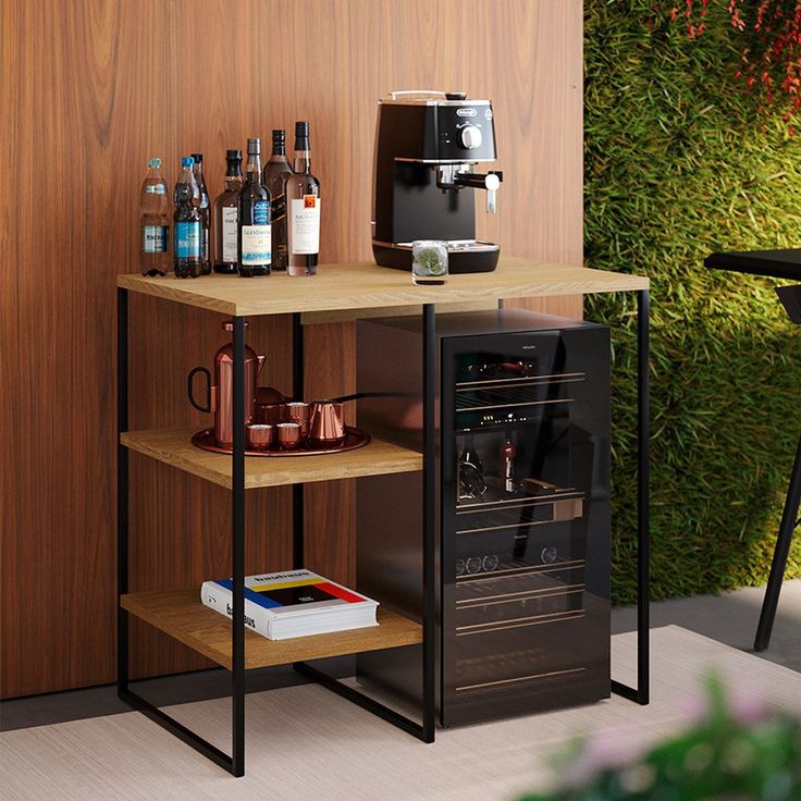 a coffee machine sitting on top of a wooden table next to a shelf filled with bottles