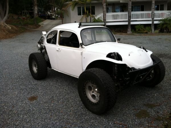 an off - road buggy parked in front of a house