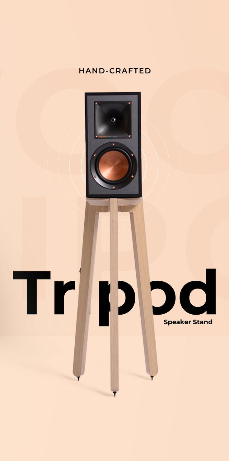 a speaker stands on top of a tripod with the words hand crafted above it