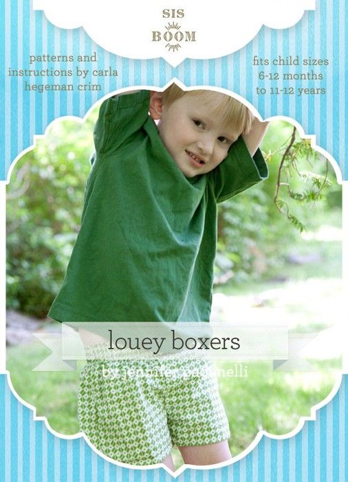 a boy in green shirt and blue shorts holding his hands up to his head with the words louey boxers on it