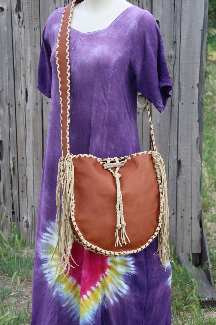 This fringed leather tote is made in soft rust color leather and has palomino color leather lace. This handmade tote measures approximately 12 inches tall x 12 inches wide x 3 inches deep and has a comfortable 48 inch flat shoulder strap. If you would like the shoulder strap shorter or longer feel free to leave us a note at checkout or contact us. This leather tote has an extra pocket inside and an antler toggle closure... This item is MADE TO ORDER. You will not receive the piece you see in the Handmade Tote, Large Leather Tote, Leather Handbags Tote, Handmade Handbags, Wedding Bag, Rust Color, Leather And Lace, Tote Handbags, Inside Pocket