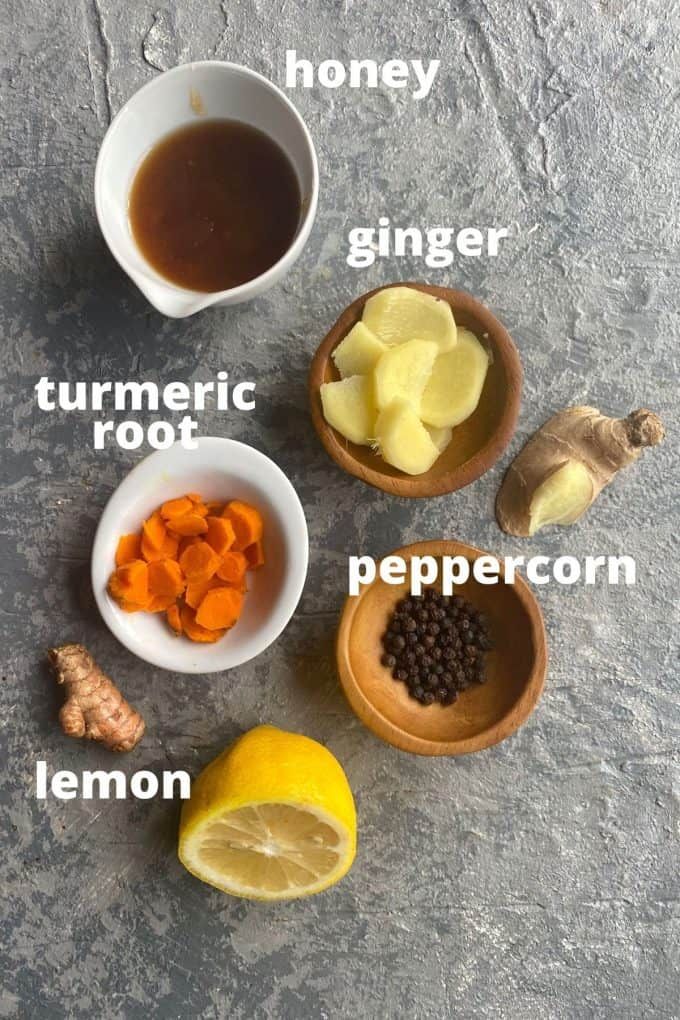 the ingredients for this recipe include lemon, ginger, turment root, peppercorn, and honey