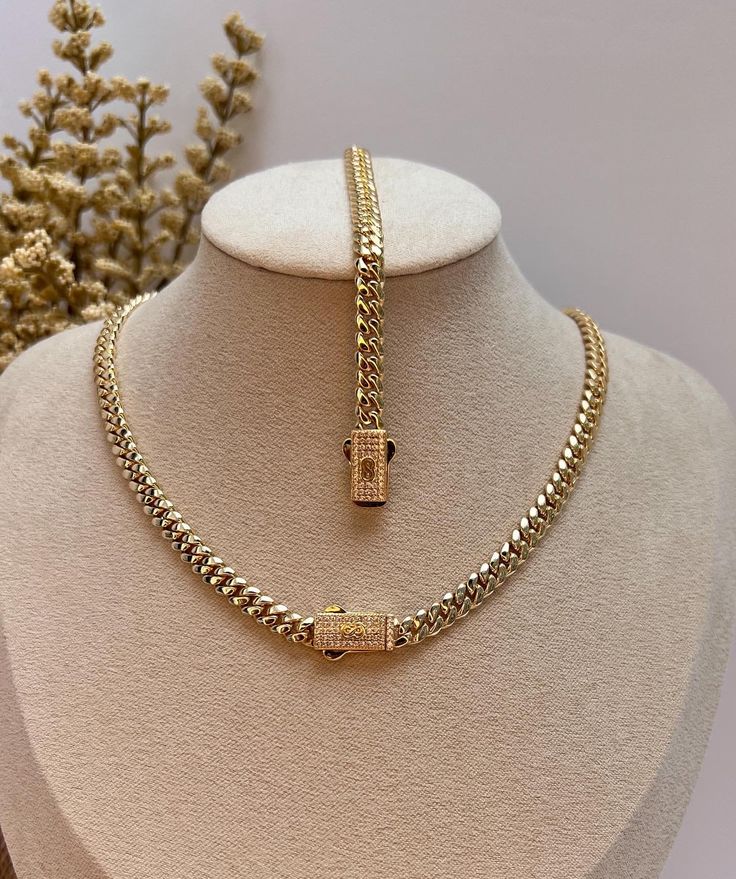 Wearing a cuban chain set is a symbol of luxury, wealth, and success. This beautiful set of Monaco chain and bracelet is designed to fit comfortably on you and to complete your everyday look. ✨DESCRIPTION✨ METAL: Stainless Steel FINISH: 14k gold plated STONE: Cubic Zirconia  WIDTH: 4mm BRACELET LENGTH: 6.5 inches and 7 inches  CHAIN LENGTH: 16 inches and 18 inches   QUALITY: WaterProof, Nickel-free, Hypoallergenic and Tarnish Free COLOR: Gold CLOSURE: BOX ✨JEWELRY CARE QUIDE✨ * Bath with warm so Luxury Gold Fitted Sets, Luxury Diamond Chain Necklaces, Luxury Diamond Chain Necklace For Women, Luxury Diamond Chunky Chain Necklace, Luxury Diamond Box Chain Necklaces, Luxury Gold Jewelry For Summer, Custom Luxury Gold Necklaces, Luxury Diamond Box Chain Bracelet As Gift, Luxury Box Chain Jewelry For Formal Occasions