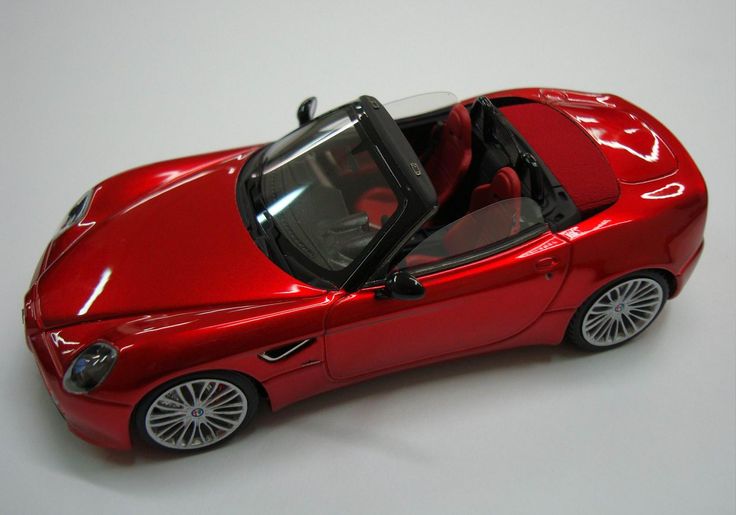 a red toy car with the top down