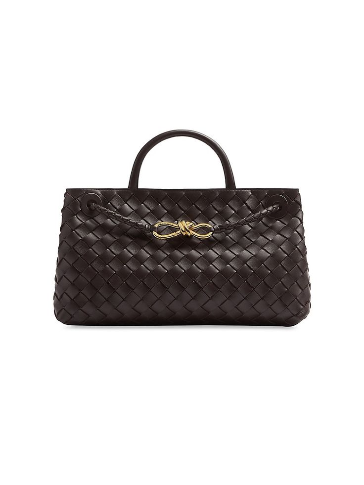 "Find BOTTEGA VENETA Small Andiamo Intrecciato Leather Top-handle Bag on Editorialist. The small Andiamo top-handle bag from Bottega Veneta flaunts the house's signature Intrecciato-pattern weave and a goldtone bow detail. Top handle Sliding crossbody strap Interior: two compartments, one zip pocket Leather Made in Italy SIZE About 11.5\"W x 7\"H x 4\"D ABOUT THE BRAND Founded in 1966, the label known for fine Italian craftsmanship with creativity at its core has since catapulted to cult-level status. The house's storied intrecciato pattern in shoes and handbags, alongside its signature minimalist ready-to-wear, have made the label an editor and It-girl favorite. Bottega Veneta. Color: Fondant." Fall Handbags, Bottega Veneta Intrecciato, Bottega Veneta Shoulder Bag, Bag Trends, Designer Shoulder Bags, New Sneakers, Purses Designer, Agent Provocateur, Everyday Bag