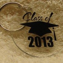 a glass keychain with a graduation cap on it and the words class of 2013