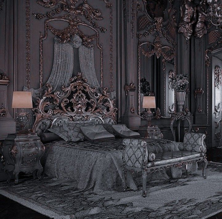 an ornately decorated bedroom is shown in black and silver colors, with chandelier above the bed