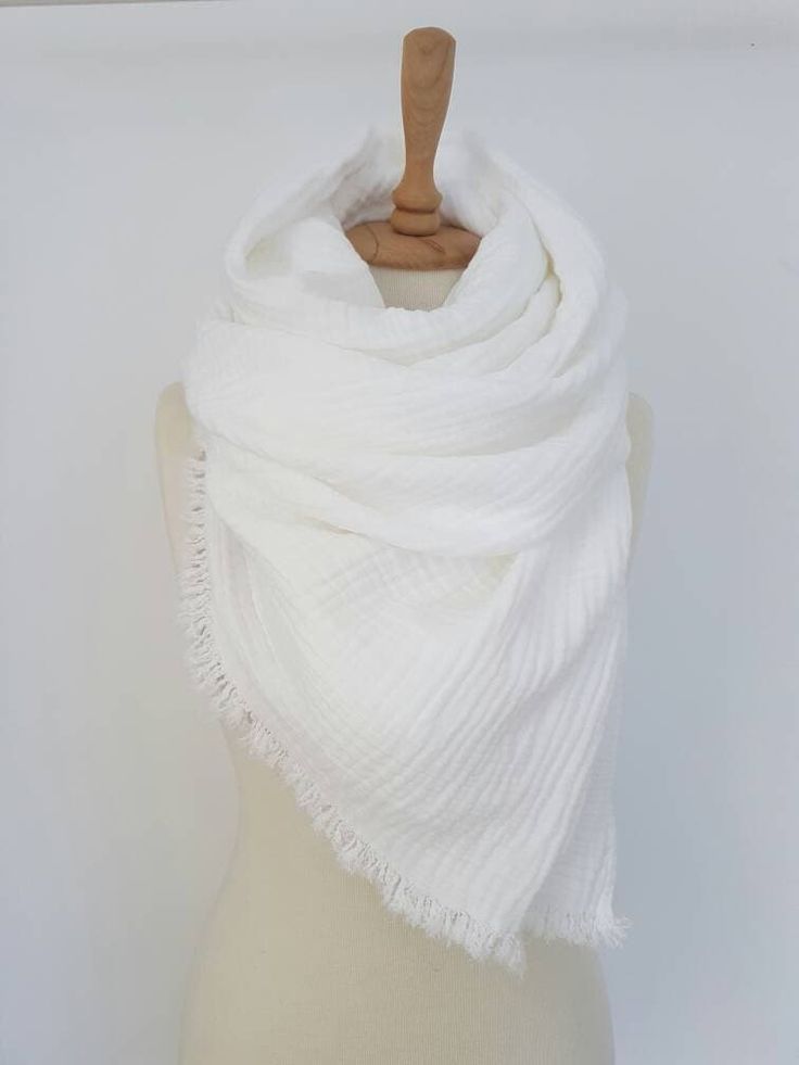 Pure Cotton Scarf in Snow White Scarf is made from naturally wrinkled  100% cotton gauze ( double layer ) ultra soft fabric and is perfect for spring, summer, autumn and light winter days. Ultra Soft Comfy scarf will keep you really Cozy !    Perfect Bridesmaid Gift Size:  ~50x220 cm / 20x87 inches ~70x220 cm / 28x87 inches ~80x220 cm / 31x87 inches ( size on photo ) Material:  - 100 % Cotton Gauze / Double Layer  Color:  - snow white Scarf is finished with fringes . Care: machine washable and d Scarf Blanket, White Scarf, White Woman, White Scarves, Oversized Scarf, Gauze Fabric, Cotton Scarf, Blanket Scarf, Beautiful Fabric