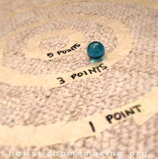 there is a blue ball on the floor next to some words that read 5 points, 3 points, and 1 point