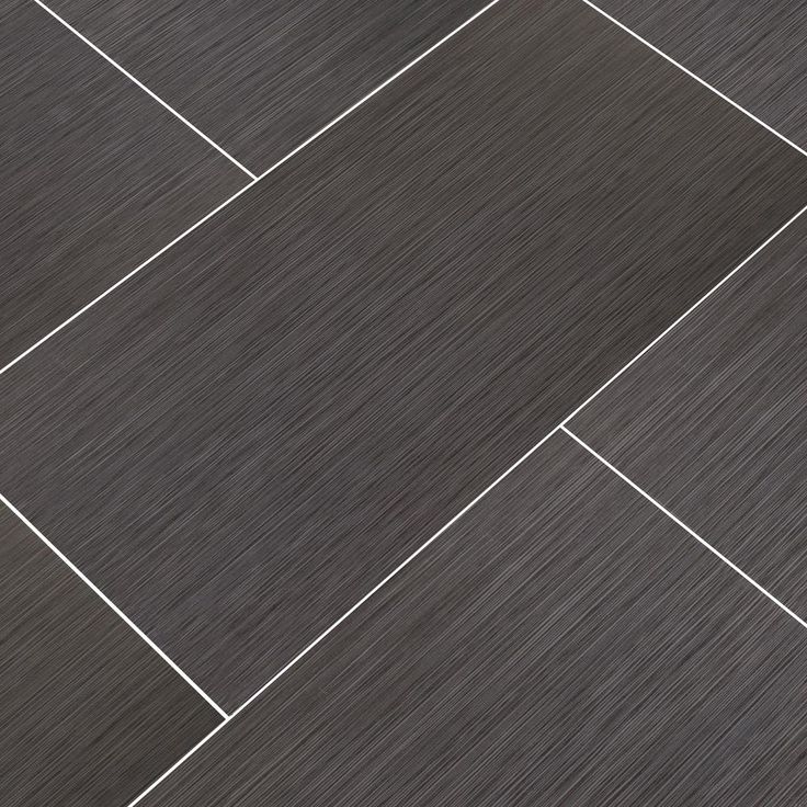 an image of a tile floor that looks like it is made out of dark wood