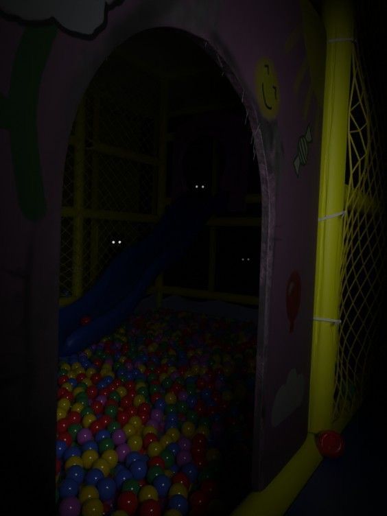 there is a ball pit in the dark with balls all over it and lights on