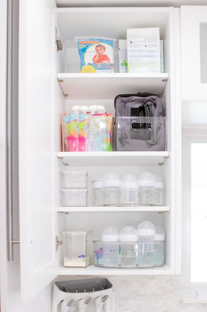 an organized pantry with plastic containers and other items