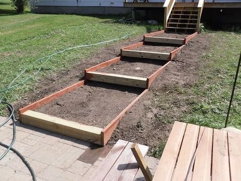 the steps are made out of wood and ready to be built into the yard area