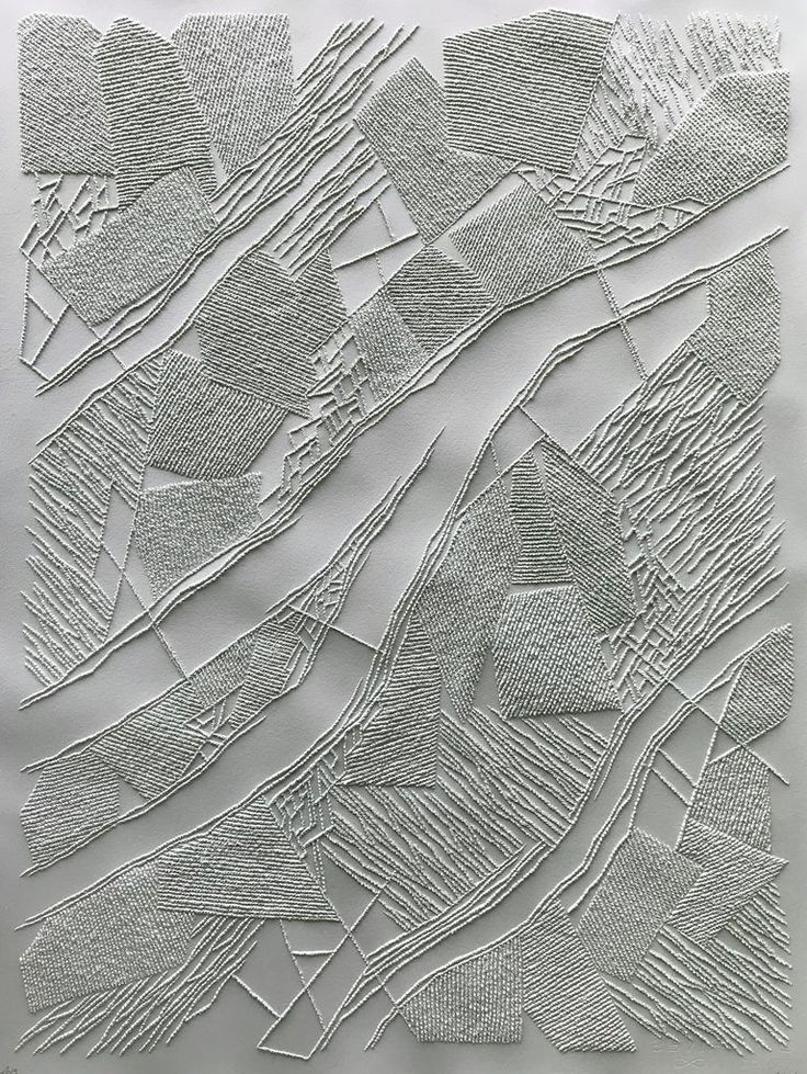 an abstract drawing made with white paper and lines on the surface, in shades of gray