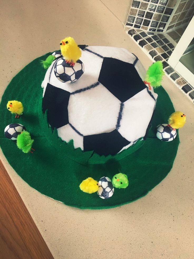 a cake with soccer balls and chicks on it