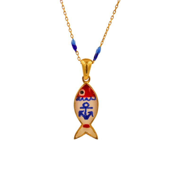 a gold plated necklace with an anchor and fish design on the front, hanging from a