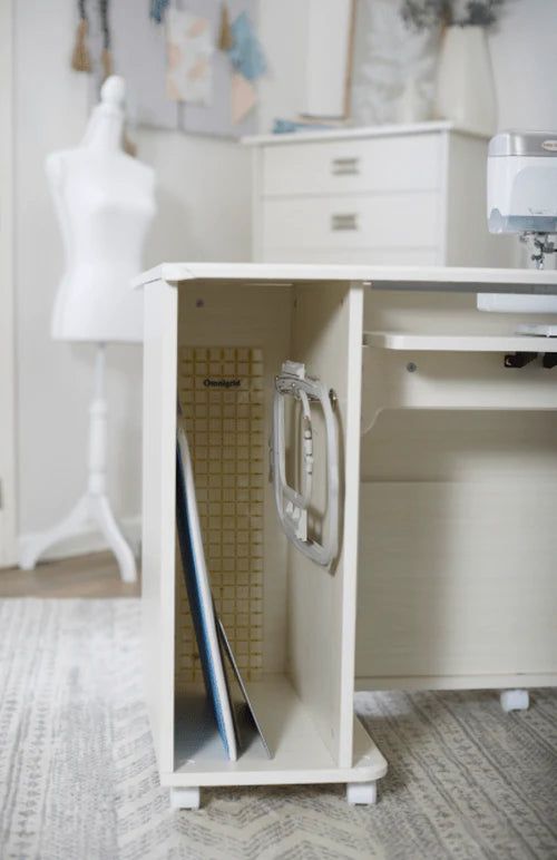 a sewing machine sits in the corner of a white cabinet next to a dressmaker's mannequin