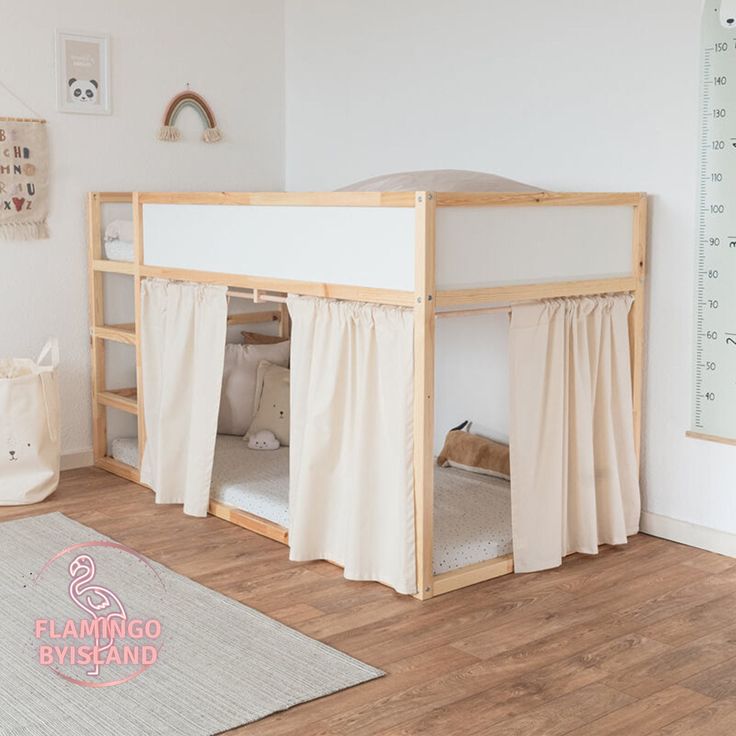 a child's bedroom with a bunk bed and curtains