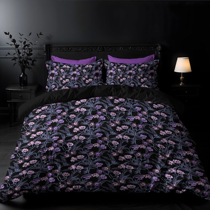 a black and purple bed in a dark room with a lamp on the side table