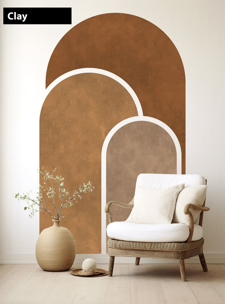 a white chair sitting in front of a wall with an arched doorway on it's side