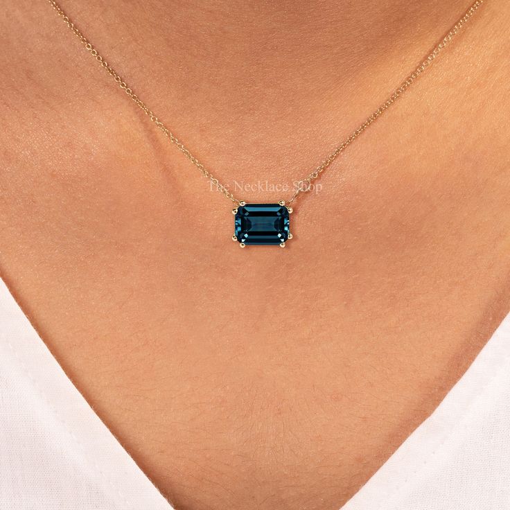 Emerald Cut London Blue Topaz Necklace, Solid 14K Gold Necklace,December Birthstone,East West Solitaire Necklace,Engagement Anniversary Gift ---------CUSTOM/DUTY-FREE SHIPPING WORLDWIDE, BUYERS DON'T HAVE TO PAY ANY CUSTOM FEES WHILE IMPORTING ------------- Details Made to order Metal : 14k Solid Gold ★ Center Stone London Blue Topaz, Emerald-cut Size: 7x9 mm Approx Weight (Ct): 2.23 ❤ Each Pendant is handmade just for you. Since these are handmade there might be a slight difference in the product. ❤ The shape of the stone might differ slightly. ★If you choose to buy the Solid Gold Chain with the pendants, it is adjustable for 14 inches, 16 inches, and 18 inches. ☂ Shipped with Insured Shipping with 4-7 business days. ➦ 100% Free Returns. ➦ Our Jewelry comes with Lifetime Warranty. (Stone Blue Emerald Cut Gemstone Necklace, Emerald Cut Sapphire Gemstone Necklace, Elegant Blue Emerald Necklaces, Blue Emerald Cut Necklace Fine Jewelry, Blue Emerald Cut Fine Jewelry Necklace, Elegant Blue Emerald Gemstone Necklace, Sapphire Jewelry With Diamond Cut Topaz, Emerald Cut Necklace, London Blue Topaz Necklace